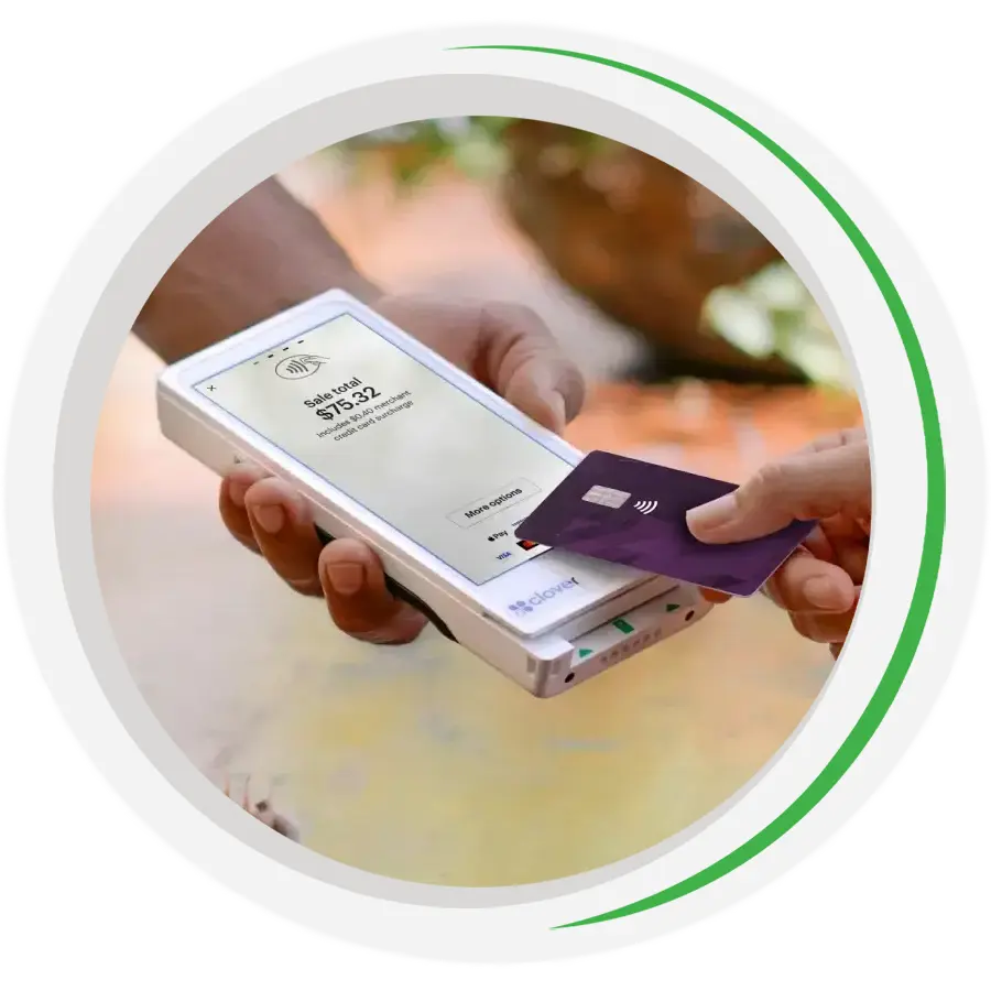 A credit card is held over a Clover Flex pocket terminal