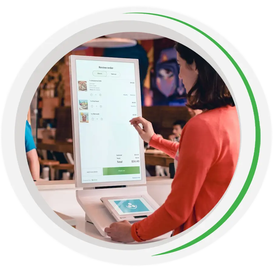 A customer selecting menu options on a Clover Kiosk